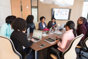 Black women meeting, using computers